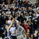 Jack Montague, center-left, in a December 2014 game against UConn. (Image via Associated Press)